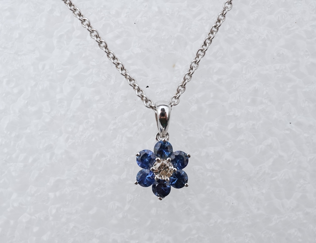 A sapphire and diamond pendant